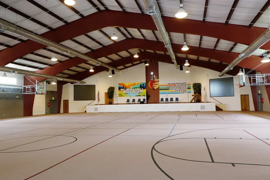 Gymnasium wide view with basketball hoops on both ends