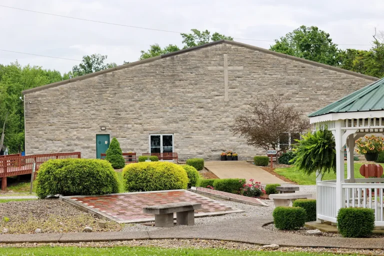 Pavilion exterior, stone building with brick memorial patio