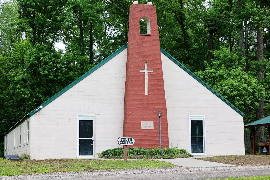 Youth Center exterior, chapel building with brick cross tower